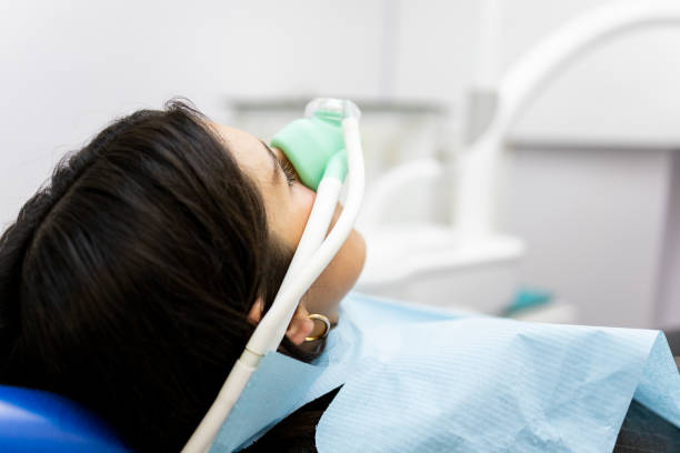 Professional dermatologist examining skin in hospital clinic