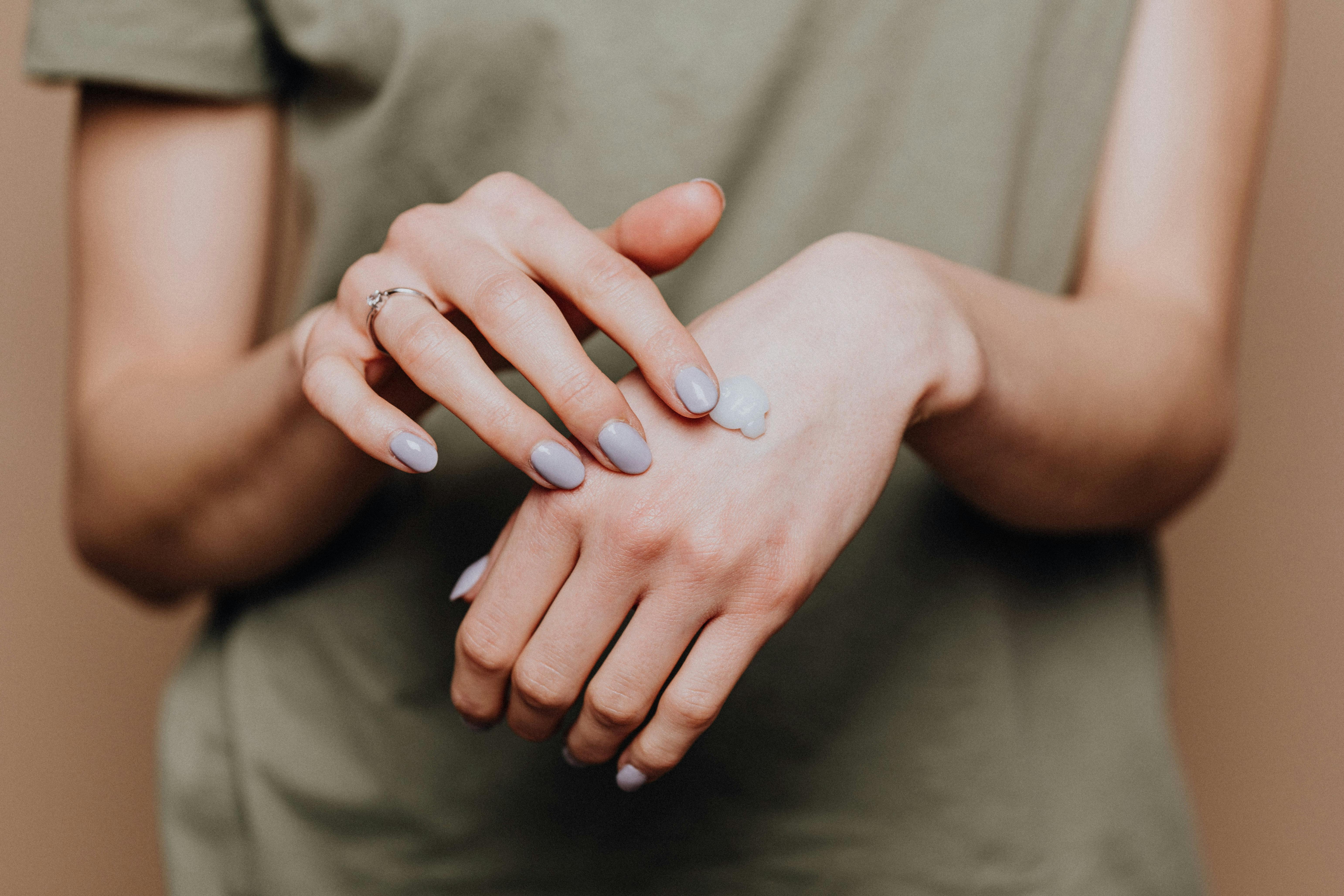Professional dermatologist examining skin in hospital clinic