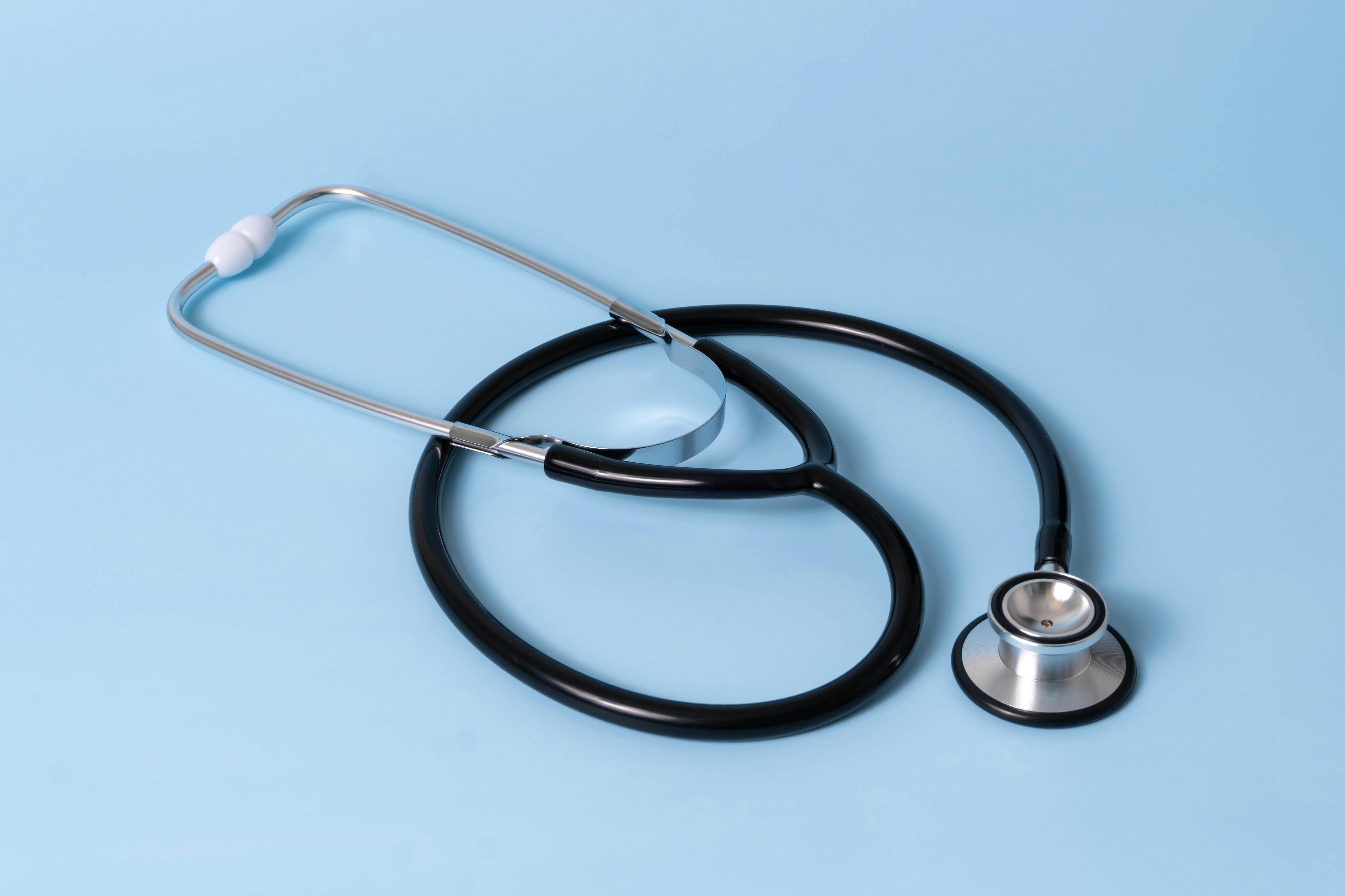 Professional dermatologist examining skin in hospital clinic